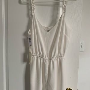 White Wilfred romper with frilly straps. Size med